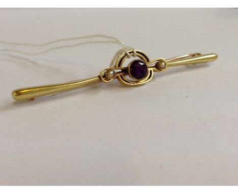 A 15 carat gold amethyst and seed pearl set bar brooch (4.2 grams overall), (replaced pin).