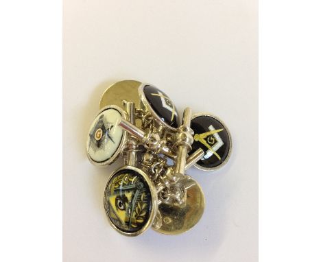 Three pairs of silver cuff-links decorated with Masonic emblems.