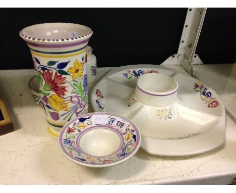 Five various Poole Pottery items.