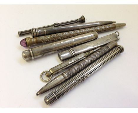 A collection of eight various silver cased propelling pencil and pencil holders.