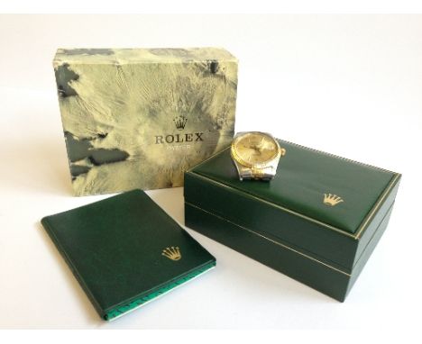 A Rolex Oyster Perpetual Datejust Superlative Chronometer steel cased two colour wristwatch, the gold dial with batons and ma