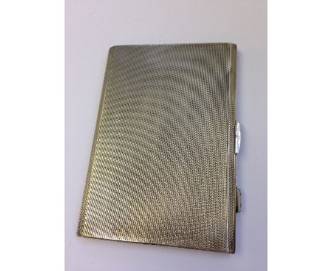 An early 20th century engine turned silver cigarette case (209.9 grams).