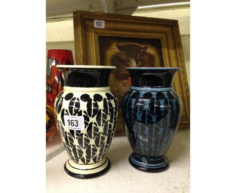 Two Poole Pottery hand painted vases, thrown by Alan Clarke, decorated in modern designs.