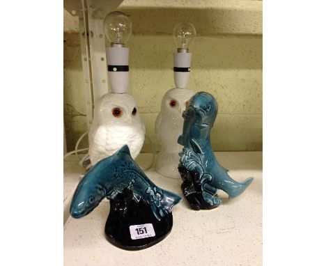 A pair of Poole Pottery white glazed Little Owl lamp bases together with two Poole Pottery blue glazed Leaping Trout ornament