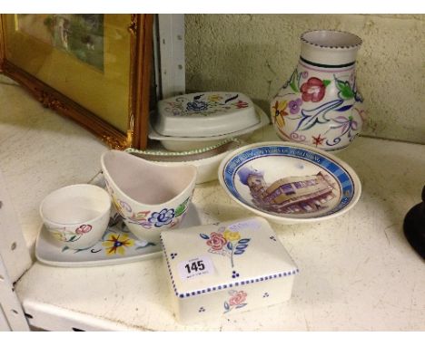 A small collection of various Poole Pottery items.