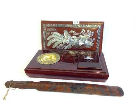A mother of pearl inlaid Chinese hardwood opium box with fitted interior containing brass dish and mother of pearl inlaid lid