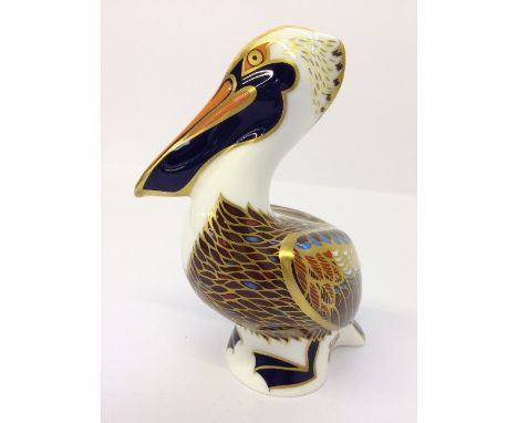 A Royal Crown Derby brown Pelican bone china paperweight, circa 1998 (with button).