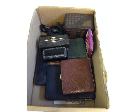 A box containing various collectables including papier mache snuff boxes, leather wallets and other items.