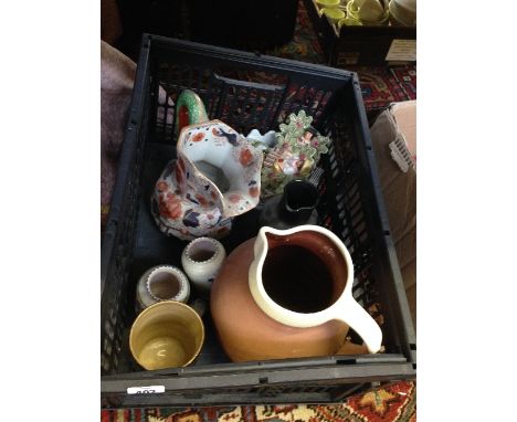 A box of china including two small Poole Pottery vases.