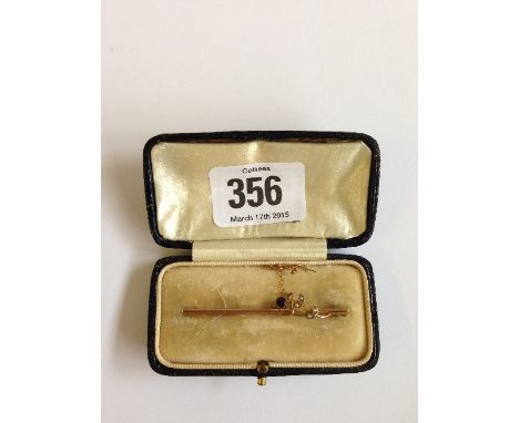 A 9 carat gold amethyst and seed pearl set bar brooch in leather case.