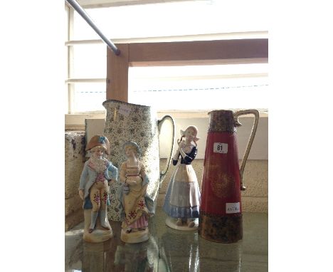 A late 19th/early 20th century bisque china figures modelled as a Girl and Boy dressed as Courtiers together with a Royal Dou