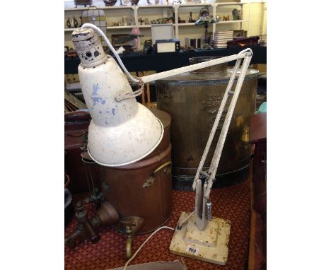 A cream painted Herbert Terry and Sons angle poise lamp on stepped base.