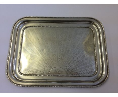 An Art Deco engine turned silver dressing table tray (445 grams).