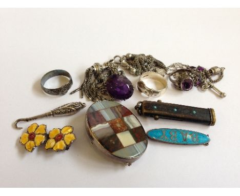 A bag containing a small collection of Victorian silver and white metal albertinas and other jewellery items.