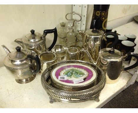 A shelf containing a quantity of various silver plated items.