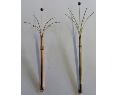 A 9ct rose gold Edwardian twizzle stick, 3.5gms, together with a silver example