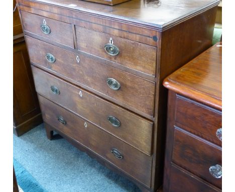 A George III oak chest of two short and three long graduated cockbeaded drawers on bracket feet, 101cm wide