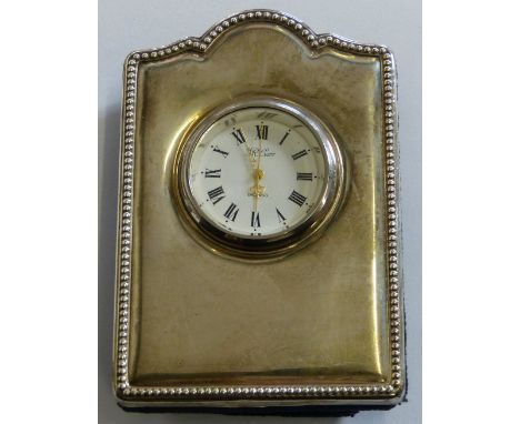 A silver mantle clock, retailed by R. Carr, quartz movement