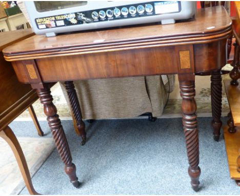 A 19th century mahogany fold-over tea table, with double gate-leg supports and four turned and wrythen fluted legs, 92cm wide