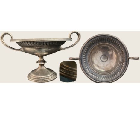 Beautiful silver cup on a curved piedouche, flared body with two lateral handles, very beautiful decoration on the outer edge