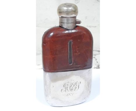 A silver plated and croc leather hip flask, length 15cm.  Condition - dings to top, wear to plate, quite dirty but glass appe