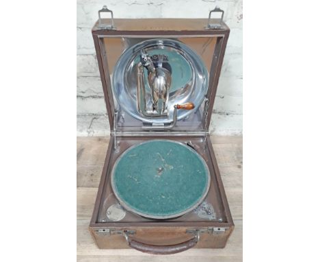 A Decca 'Trench' Dulcephone portable gramophone in stitched leather case, patent no. 3033, R.D. no. 631877, with internal alu