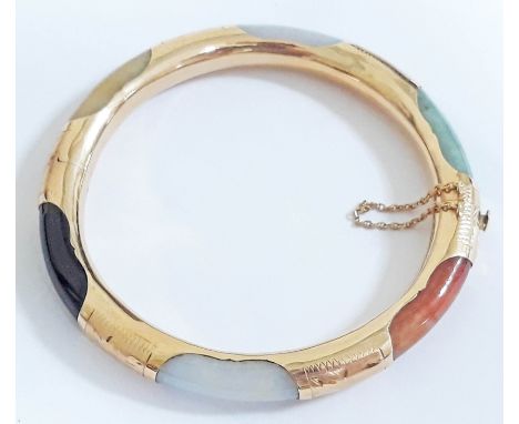 A Chinese 14K multi-coloured jade bangle, marked '14K' & 585', diam. 7cm, wt. 27g. 