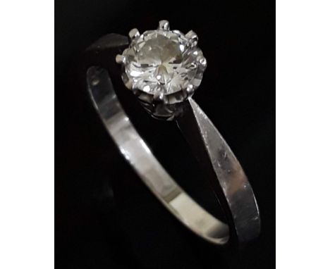 A single stone diamond solitaire ring, the round brilliant cut diamond wt. 0.50 carats, hallmarked 18ct white gold band, gros