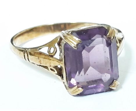 A 9ct gold ring set with an amethyst coloured stone, marked '9ct', gross wt. 2.2g, size M. 