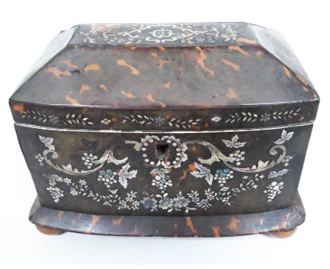 A 19th Century mother of pearl inlaid tortoiseshell tea caddy of sarcophagus form sat on four turned bun feet, length 20cm.  