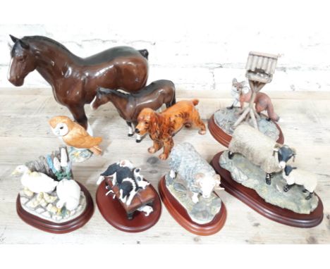A quantity of ornaments comprising two Beswick horses and a Beswick owl, a Goebel dog and five Border Fine Arts models. 