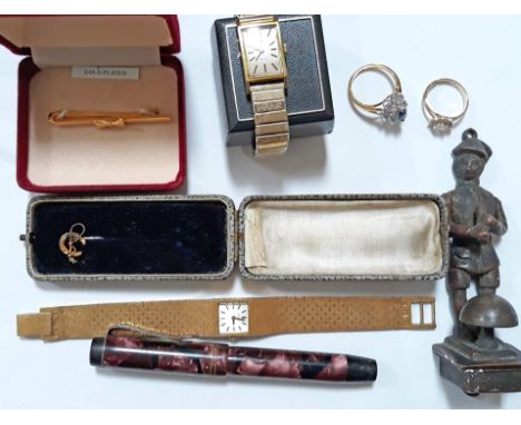 A mixed lot comprising two gold plated watches, a vintage pen, a door knocker and costume jewellery. 