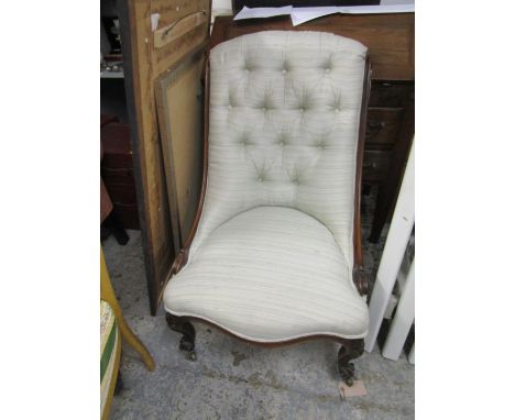 A 19th century rosewood slipper chair, button back upholstered in a light stripped green and white fabric on floral knee carv
