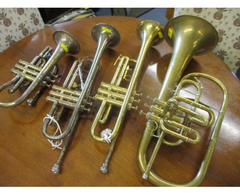 A Besson &amp; Co bugle, a B&amp;M chapion trumpet and two other instruments 