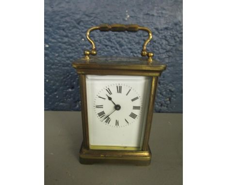 A French brass cased five window carriage clock with key 