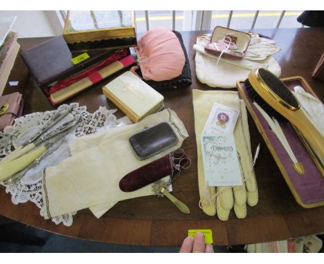A selection of evening bags, gloves, button hooks, glove stretchers, scissors and other items to include a cased dressing tab