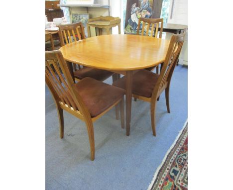 A G-Plan teak extending dining table and four matching chairs, 28 2/8" x 42 1/2" x 42" 