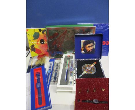 A late 20th century collection of Swatch Watch related items to include eight brand new Swatch watches, calendar's and epheme