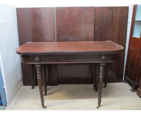 A Regency mahogany concertina action extending dining table/side table with a foldover top, extending with three additional l