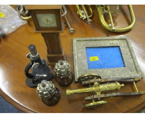 Collectables to include a pair of de-activated hand grenades, a brass cannon, a Japanese silver plated frame, a miniature gra