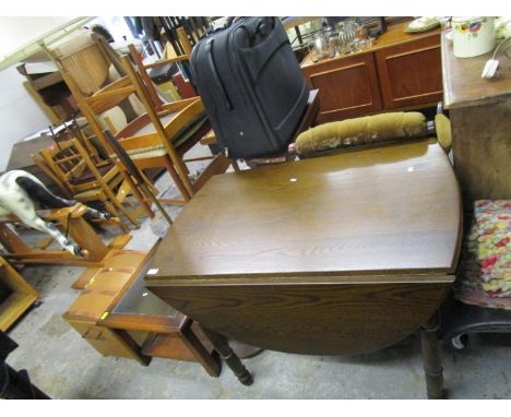 An oak gateleg table on turned legs, 29 1/2" x 39 1/2" x 53", a retro brass and wooden standard lamp with fabric shade and a 