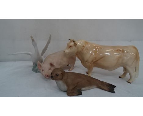 A Beswick bull, Nao swan and an Aynsley pig and seal