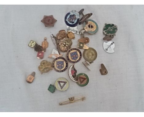 A box of enamel badges