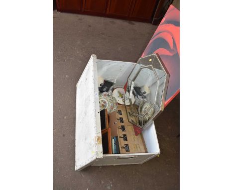 A metal storage trunk and assorted contents to include picture frames, octagonal wall mirror, ceramics and other items