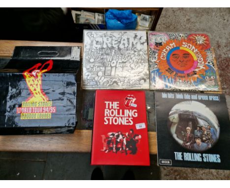 Rolling Stones memorabilia; first edition book, vinyl LP and two cream vinyl LPs. 