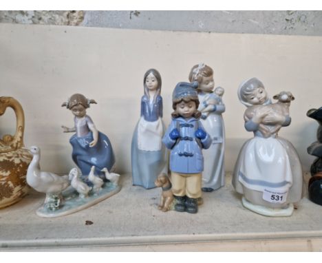 A Lladro figurine (5503) and four Nao figurines. 