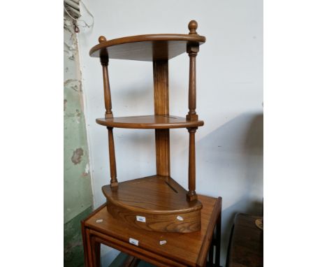 An Ercol elm three tier corner stand. 