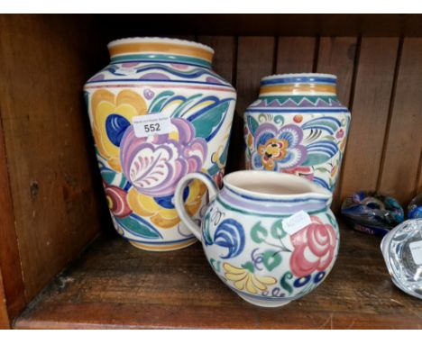 Three pieces of 1950s Poole pottery; two vases and a jug. 