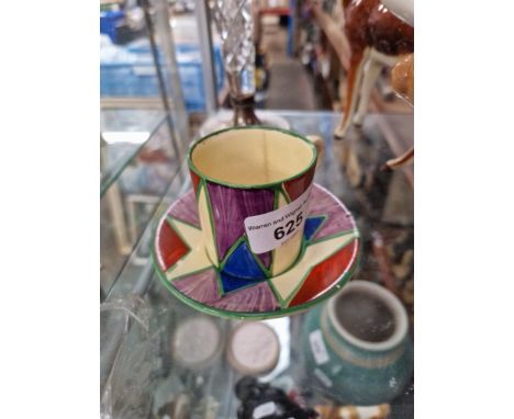 A Clarice Cliff Bizarre coffee can and saucer. 