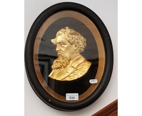 A late 19th/early 20th century framed gilt metal portrait of Charles Dickens, 27cm x 34cm overall. 
